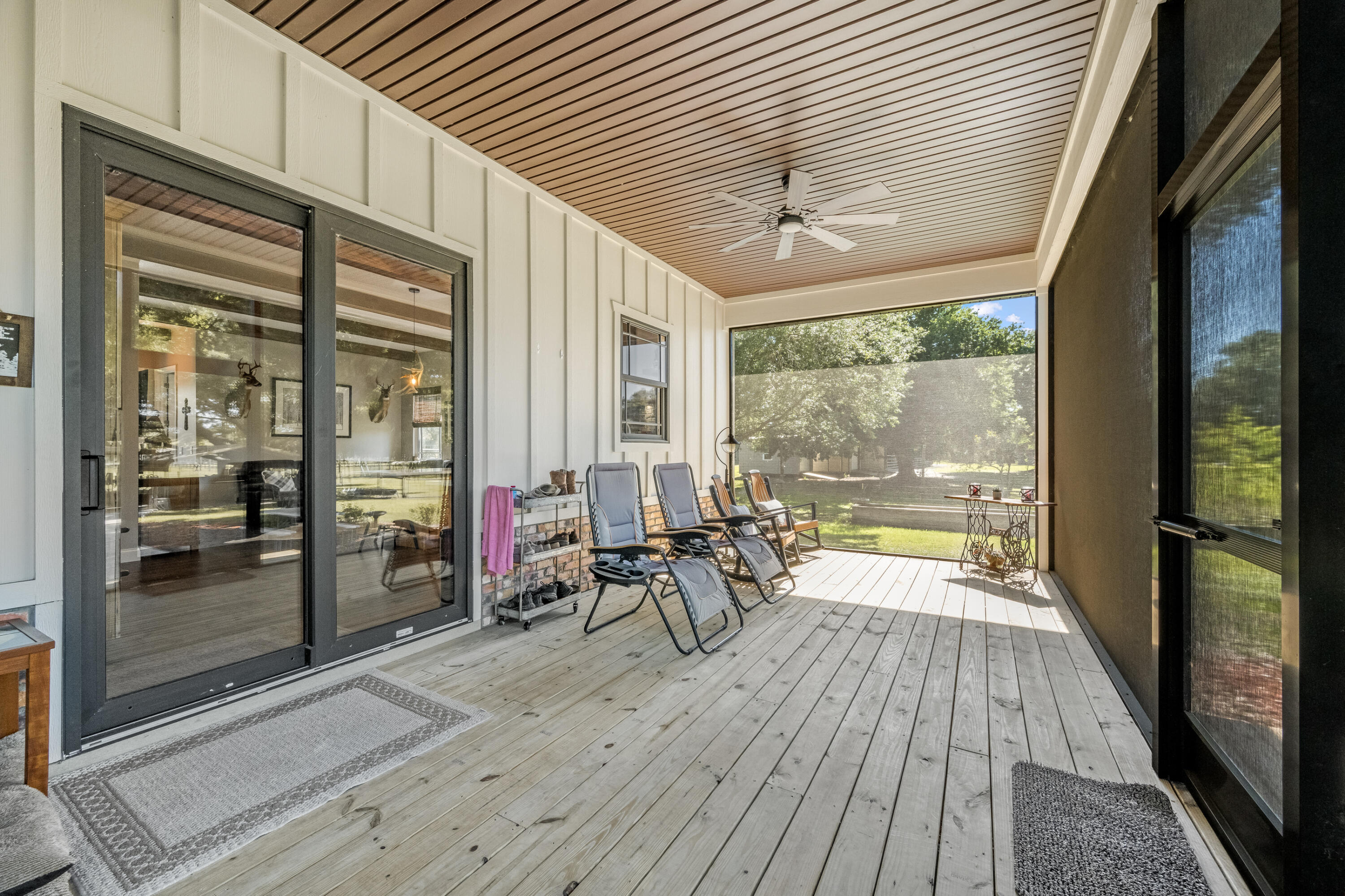4600 Dixie Way Mims, FL 32754 - Photo 25 of 86 a view of a patio with table and chairs and wooden floor