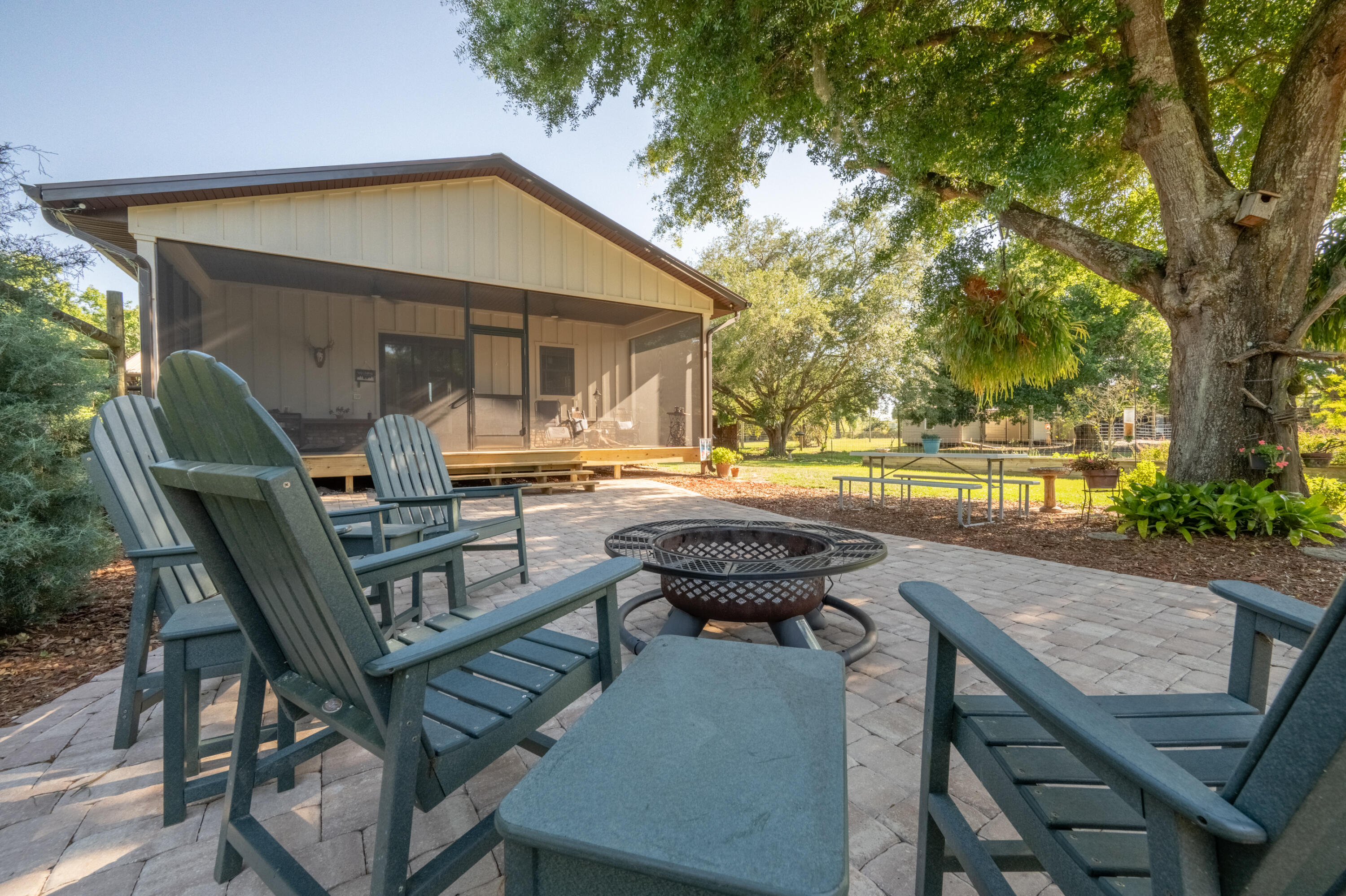 4600 Dixie Way Mims, FL 32754 - Photo 27 of 86 a view of a wooden chairs and table in the patio