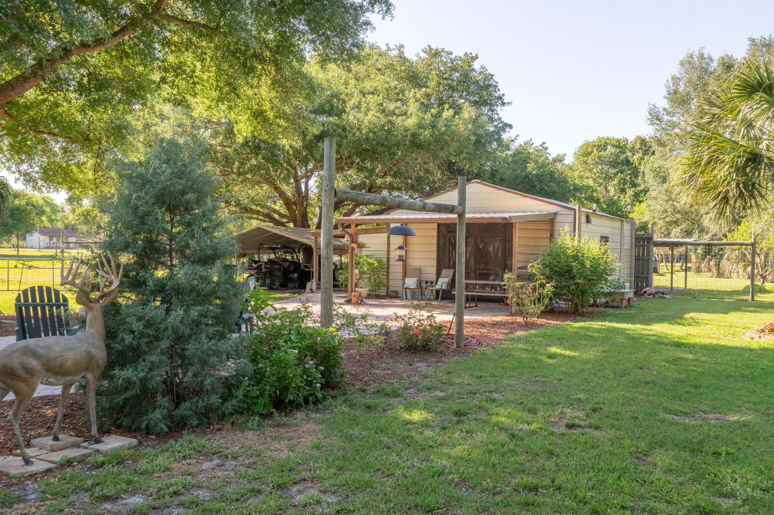 4600 Dixie Way Mims, FL 32754 - Photo 28 of 86 a view of a house with backyard porch and garden