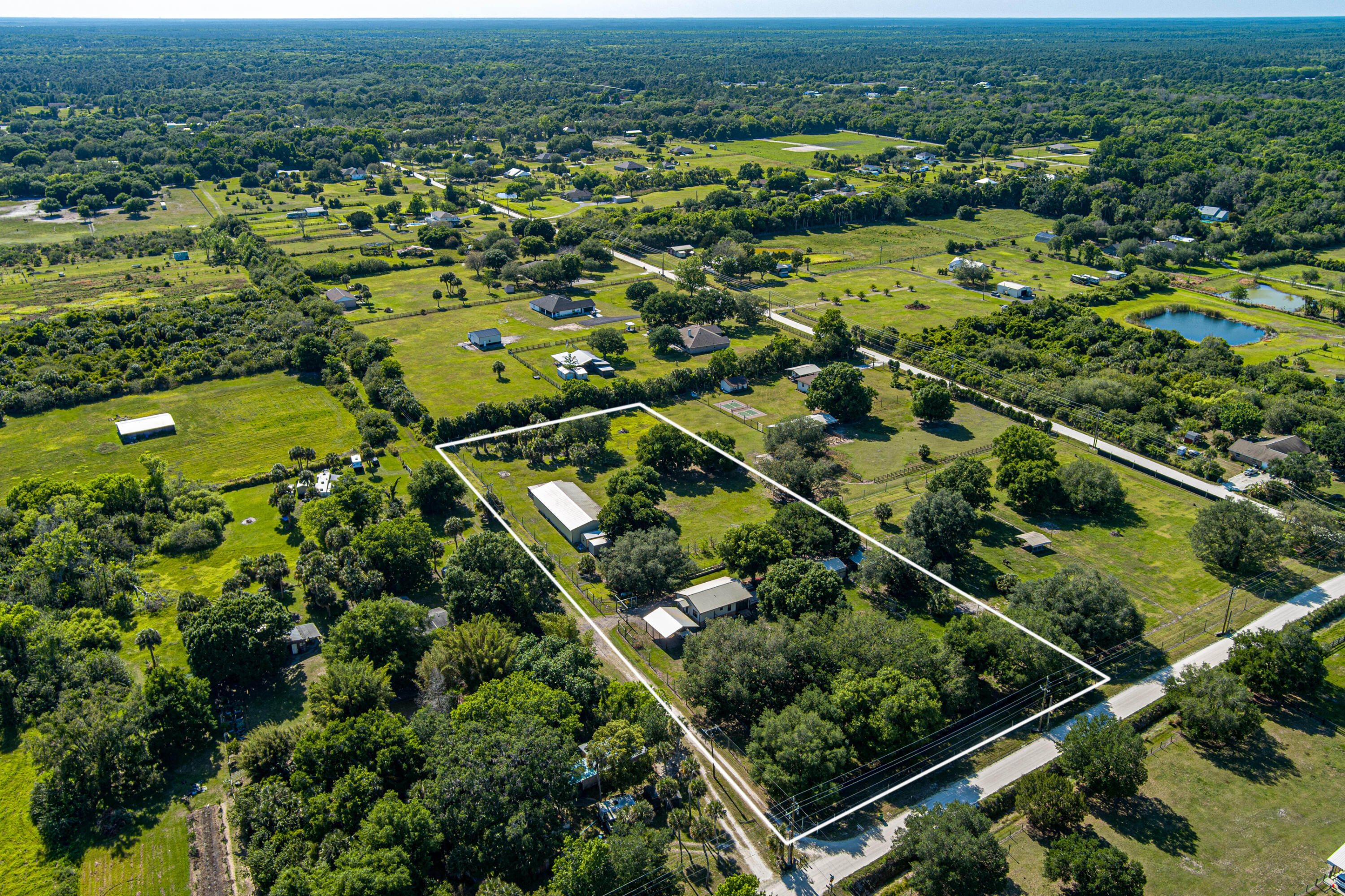 4600 Dixie Way Mims, FL 32754 - Photo 3 of 86 an aerial view of residential houses with outdoor space and trees