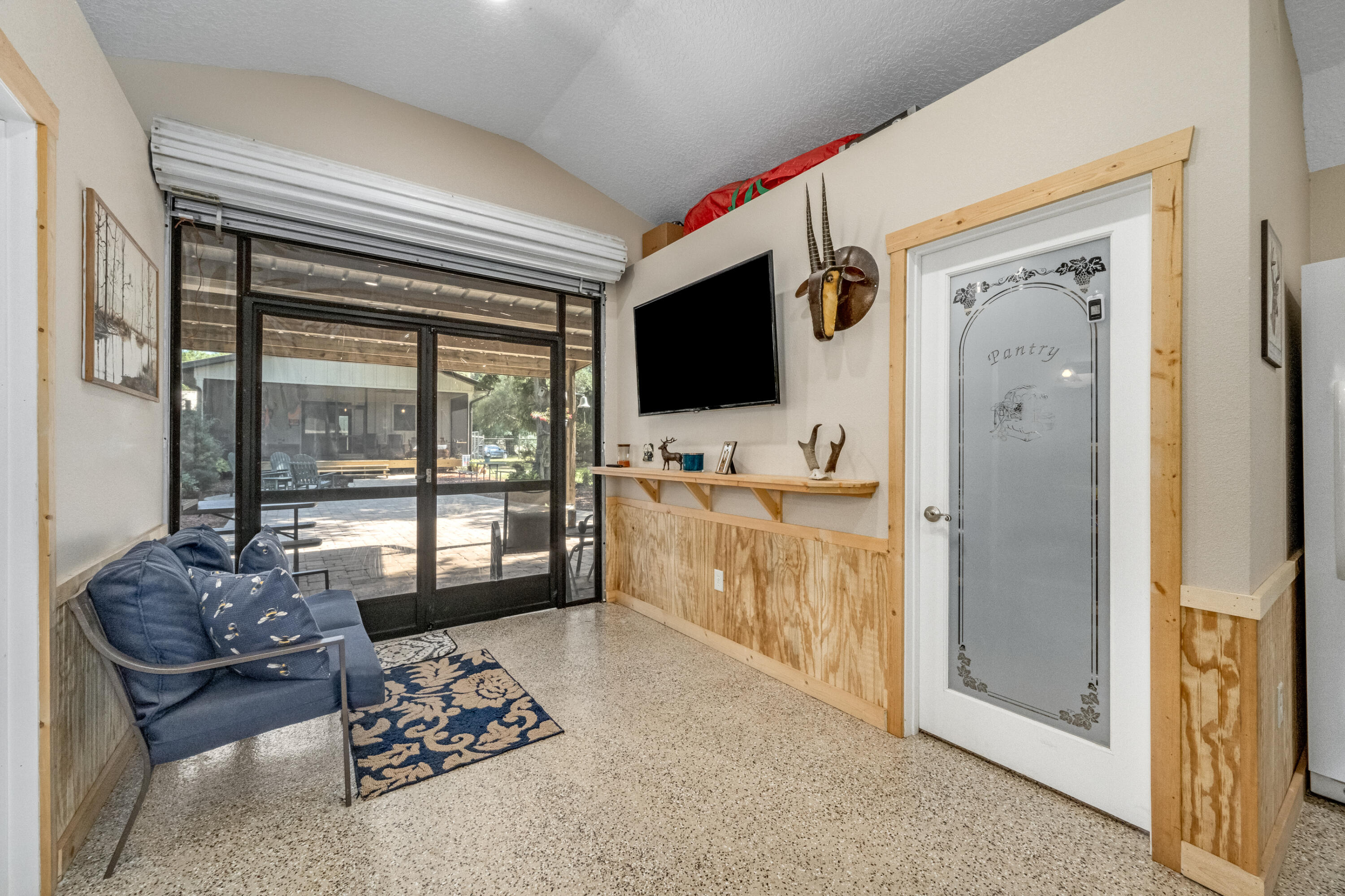 4600 Dixie Way Mims, FL 32754 - Photo 33 of 86 a living room with furniture and a flat screen tv