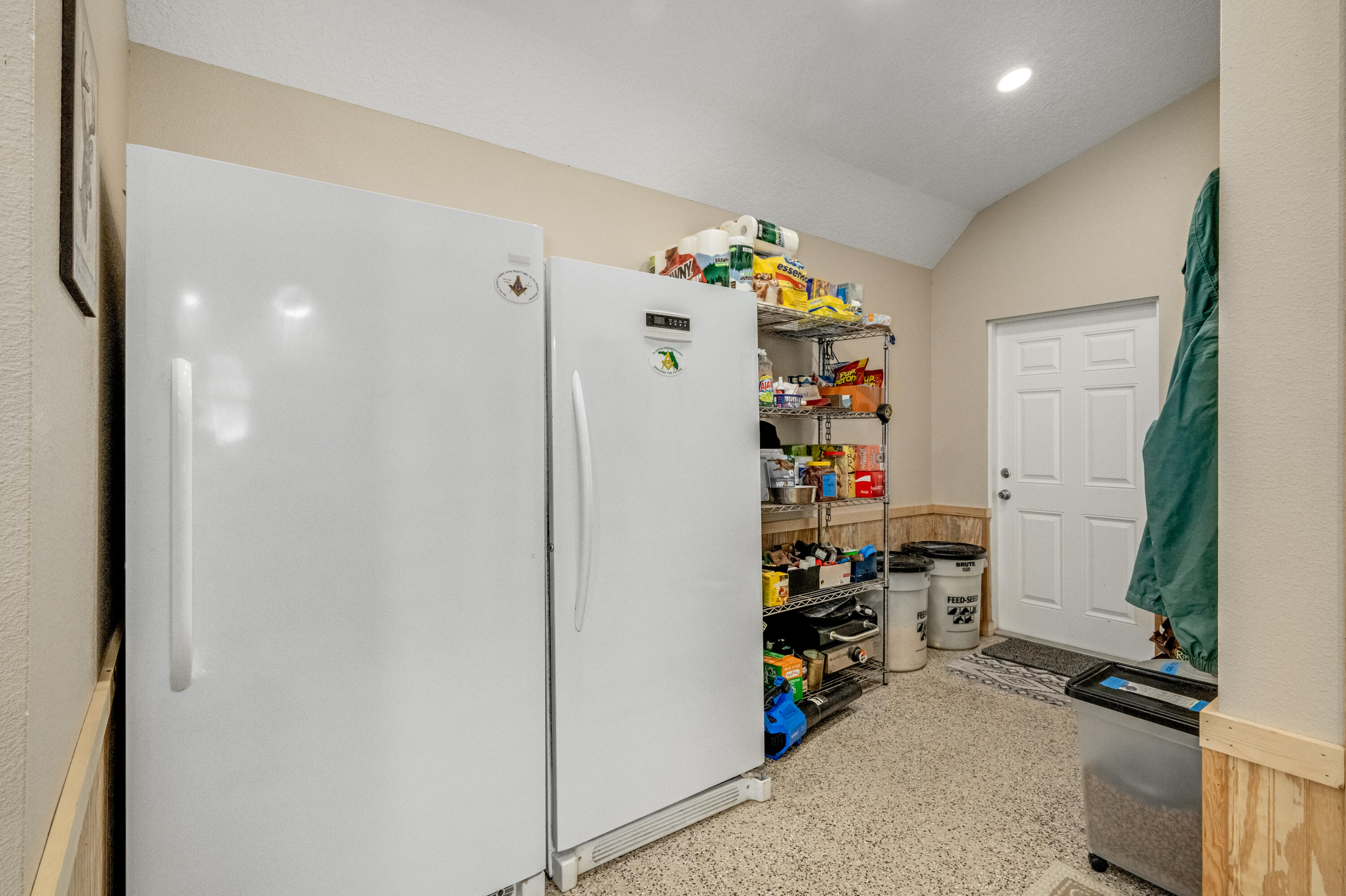 4600 Dixie Way Mims, FL 32754 - Photo 35 of 86 a view of walk in closet with clothes and shoes
