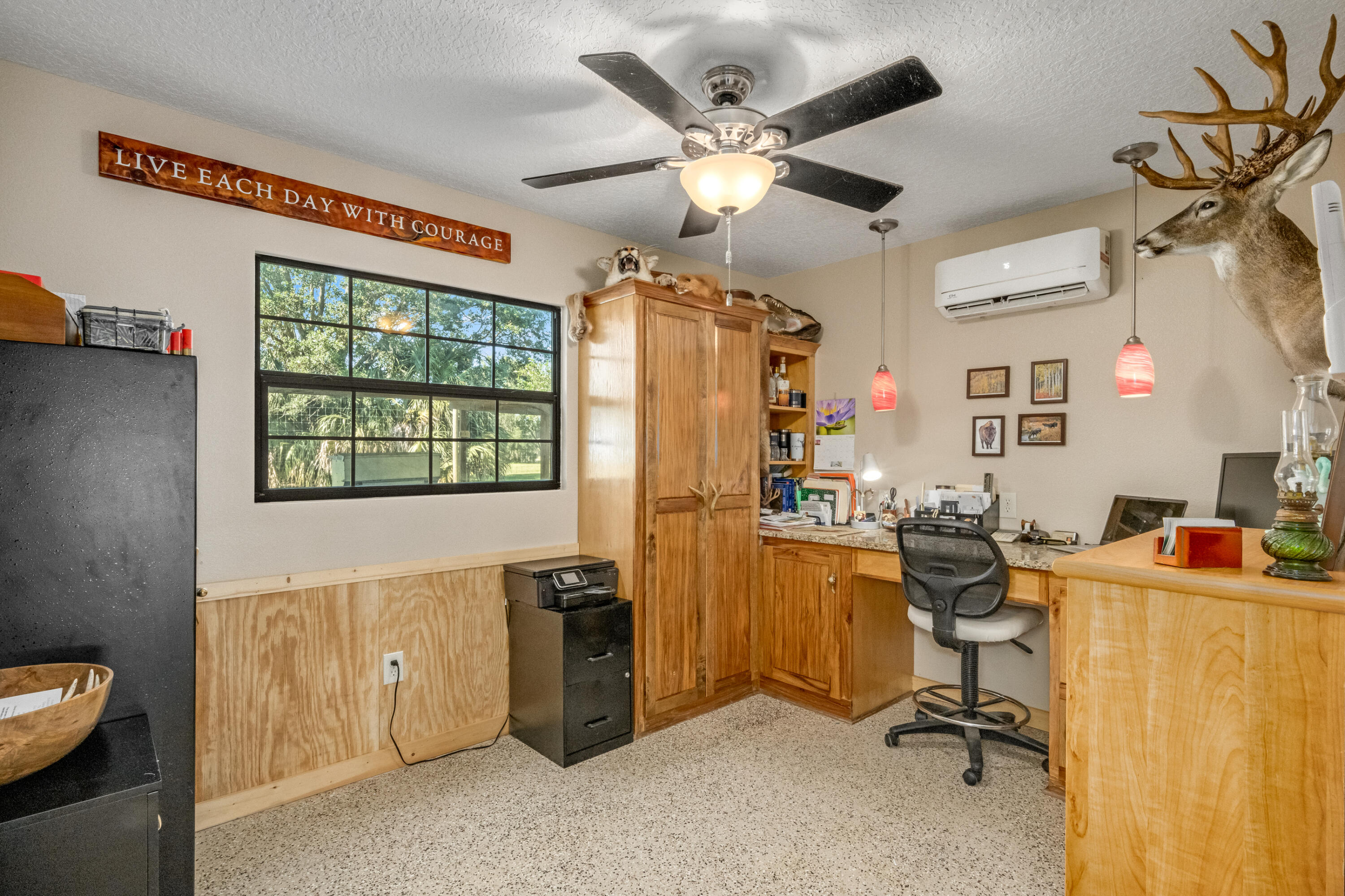 4600 Dixie Way Mims, FL 32754 - Photo 36 of 86 a view of a workspace with furniture and a window