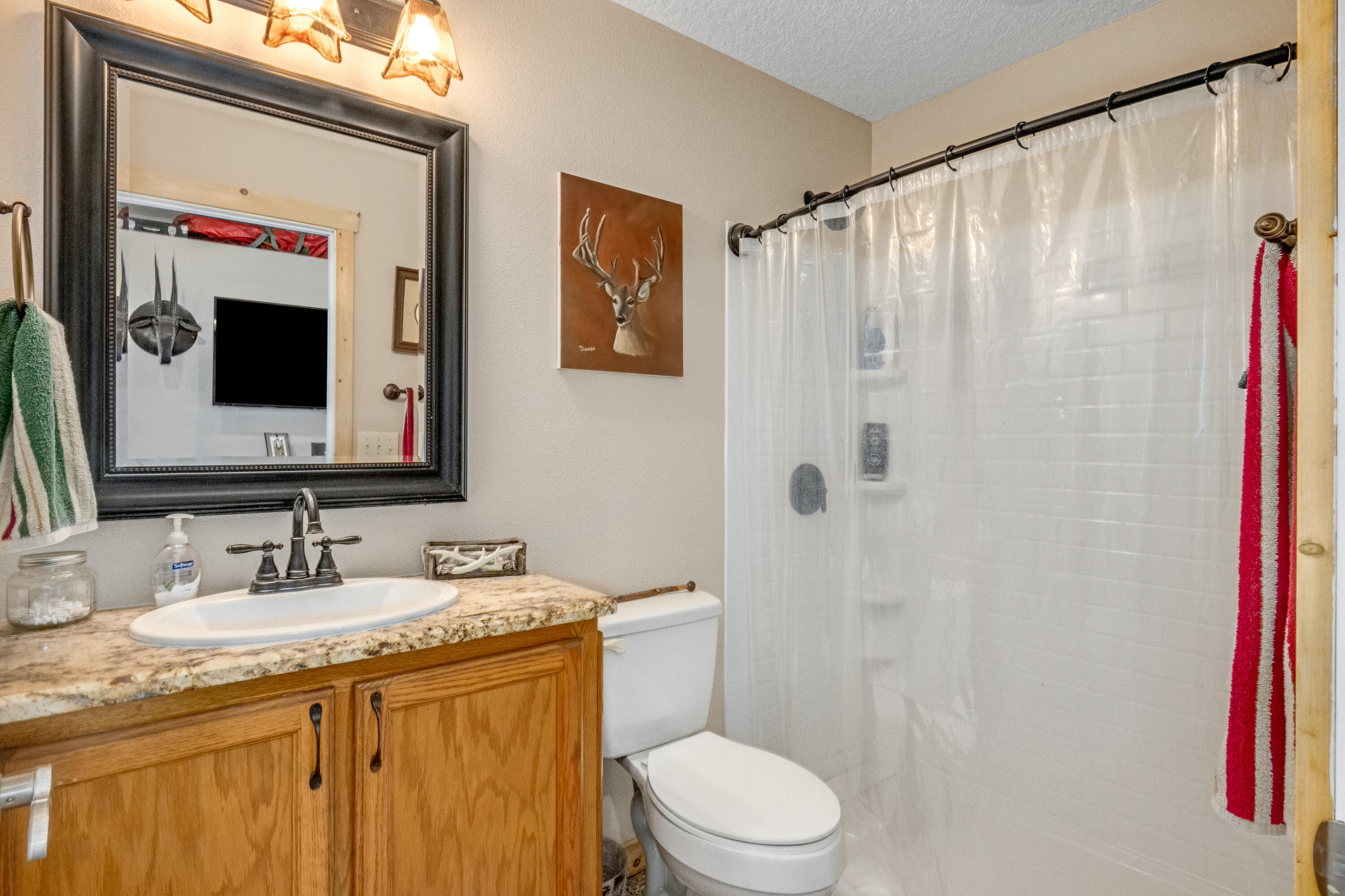 4600 Dixie Way Mims, FL 32754 - Photo 39 of 86 a bathroom with a granite countertop sink toilet and shower