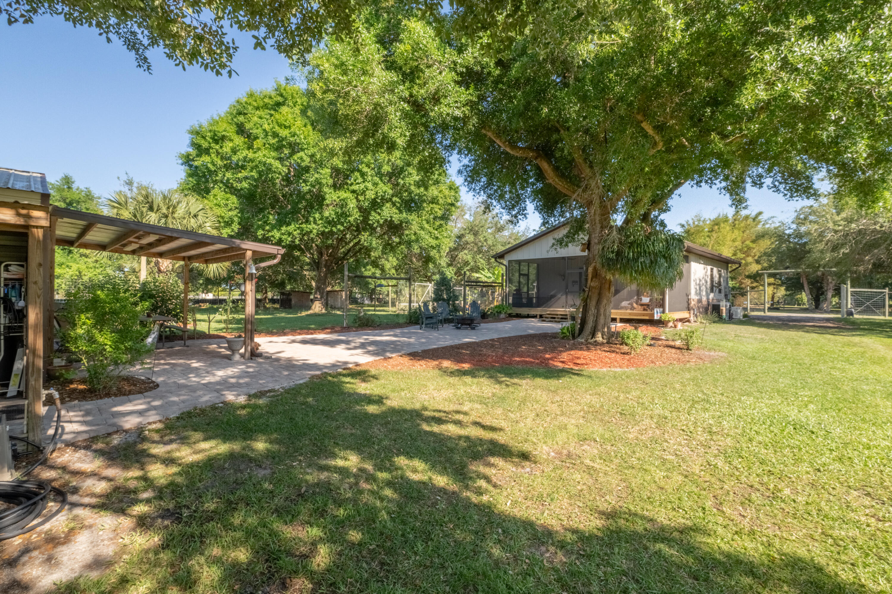 4600 Dixie Way Mims, FL 32754 - Photo 61 of 86 a view of a house with swimming pool and sitting area