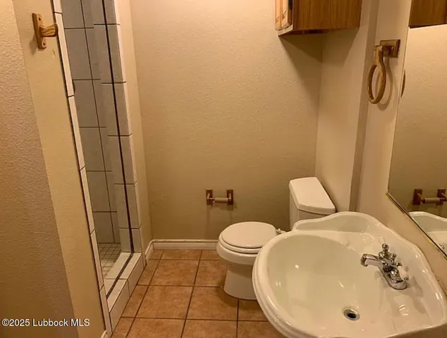 a bathroom with a sink and toilet