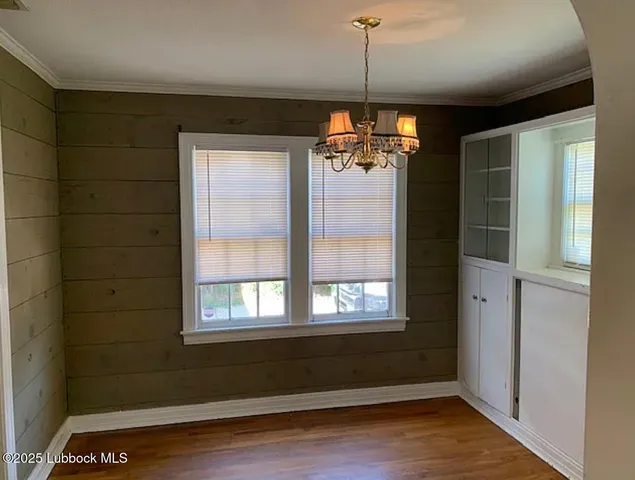 a view of a livingroom with a ceiling fan and window