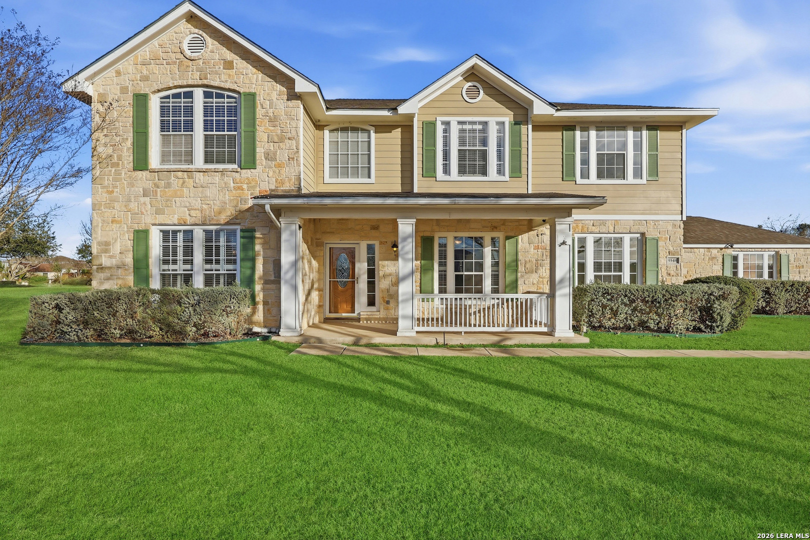 front view of a house with a yard