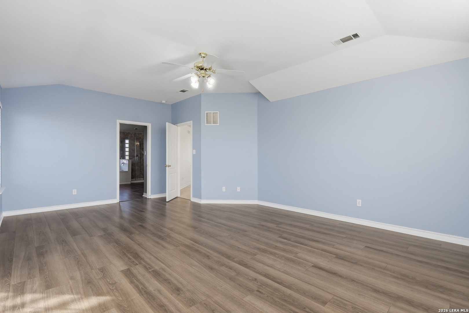 9348 Remuda Path San Antonio, TX 78254 - Photo 15 of 27 a view of an empty room with wooden floor