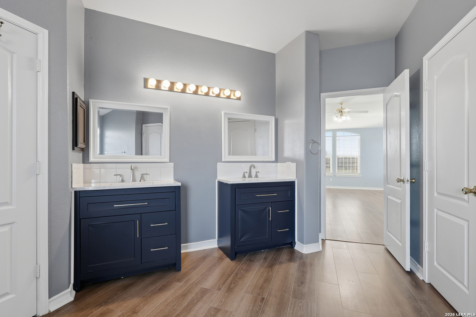 9348 Remuda Path San Antonio, TX 78254 - Photo 17 of 27 a spacious bathroom with a sink and a mirror