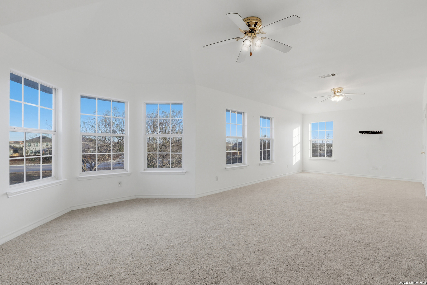 9348 Remuda Path San Antonio, TX 78254 - Photo 18 of 27 a view of an empty room with a window