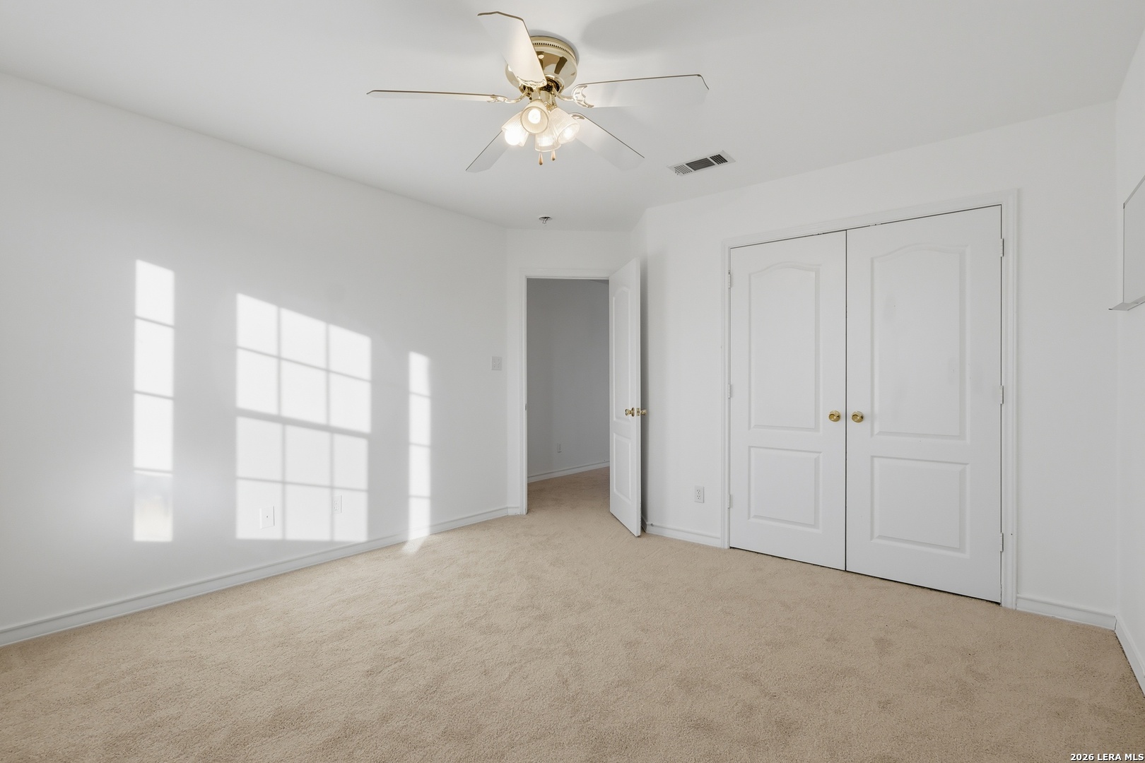 9348 Remuda Path San Antonio, TX 78254 - Photo 22 of 27 a view of an empty room with a ceiling fan