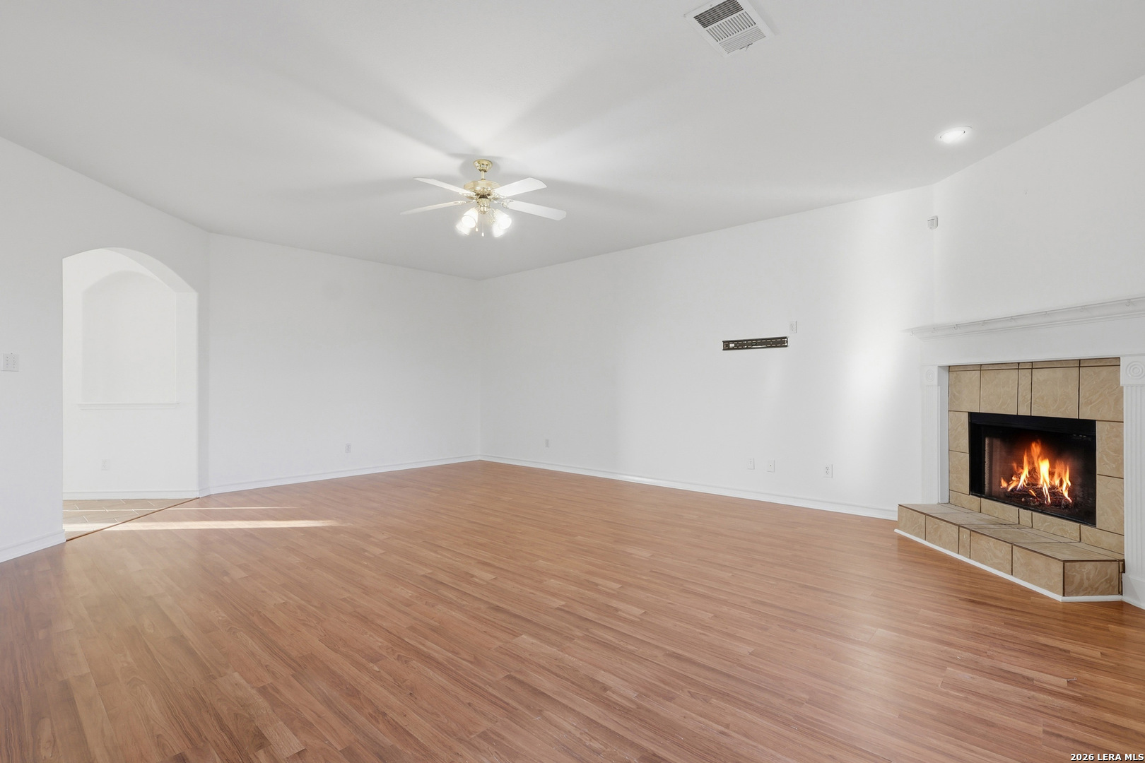 9348 Remuda Path San Antonio, TX 78254 - Photo 9 of 27 a view of empty room with wooden floor and fireplace