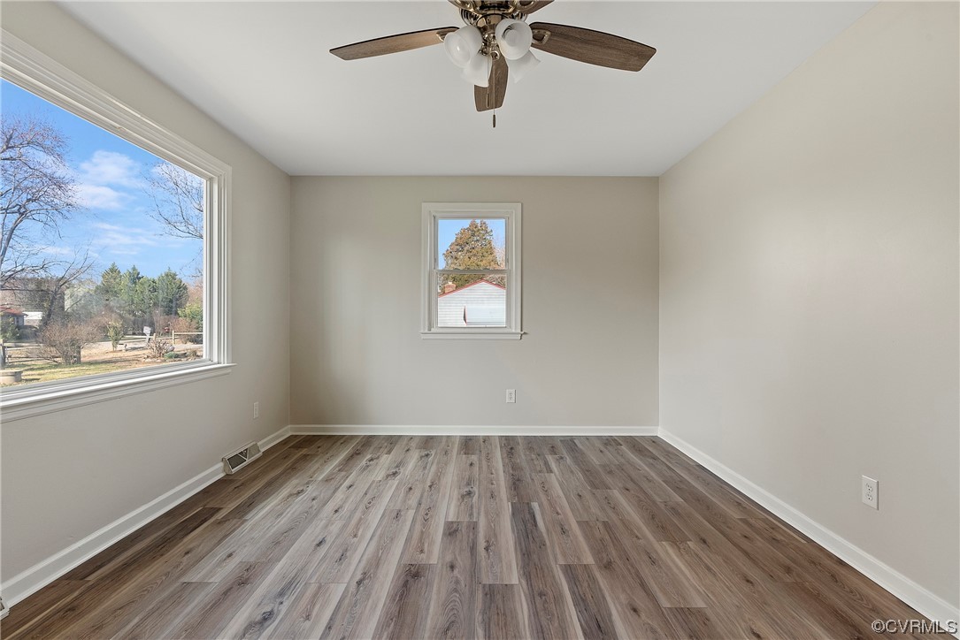 10820 River Road Chesterfield, VA 23838 - Photo 5 of 27 wooden floor in an empty room with a window