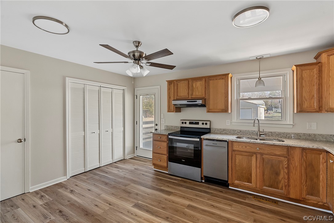 10820 River Road Chesterfield, VA 23838 - Photo 10 of 27 a kitchen with stainless steel appliances granite countertop a stove top oven a sink dishwasher a microwave oven with cabinets and wooden floor