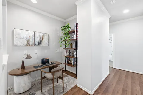 a room with furniture and wooden floor