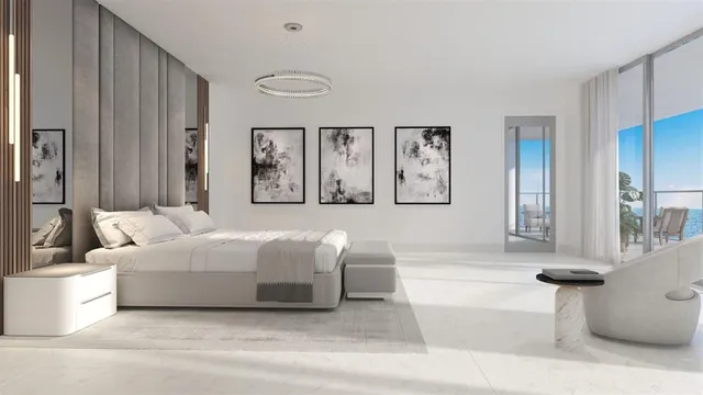 a living room with furniture and a painting on the wall