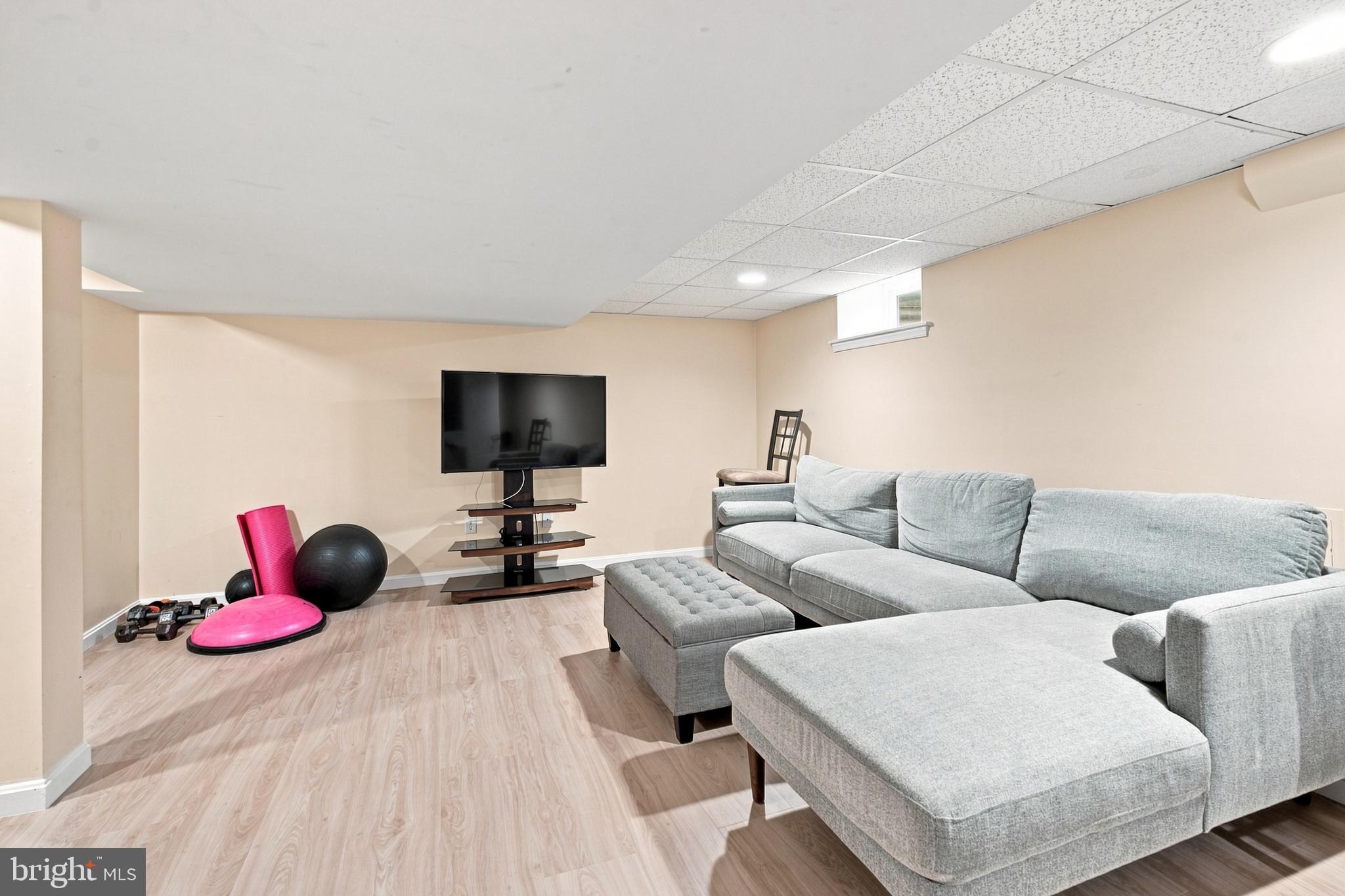 123 Harrogate Road Wynnewood, PA 19096 - Photo 32 of 40 Modern basement retreat for relaxation.