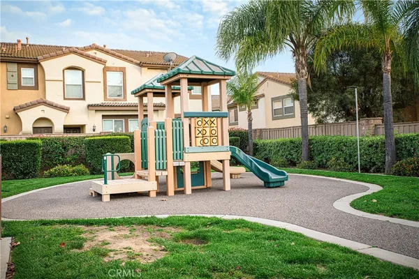 a view of a house with backyard porch and sitting area