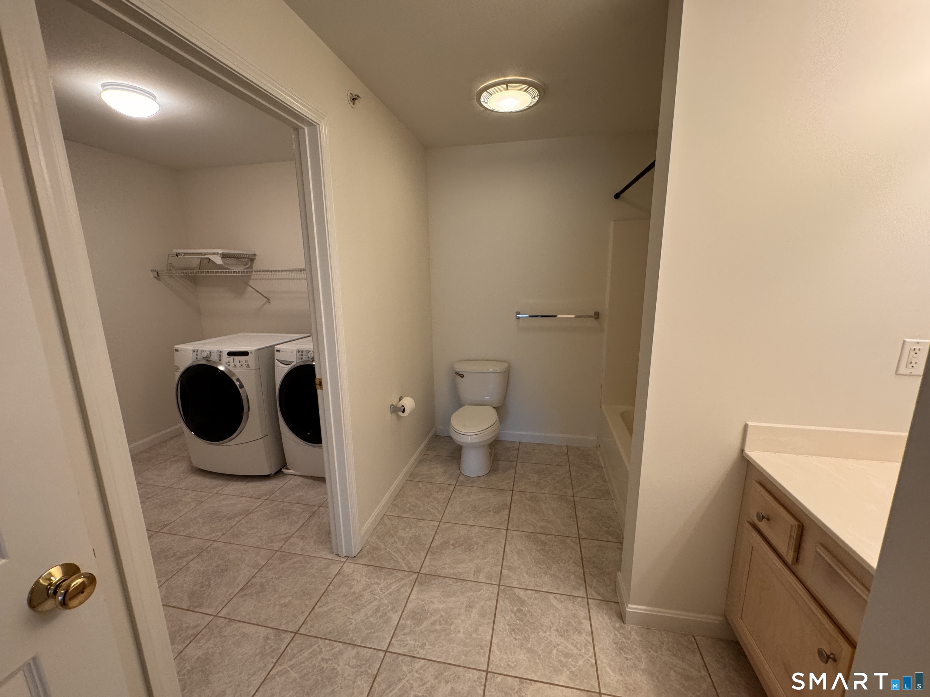 128 Meridian Street, Unit 211 Groton, CT 06340 - Photo 11 of 23 a bathroom with a toilet and a sink