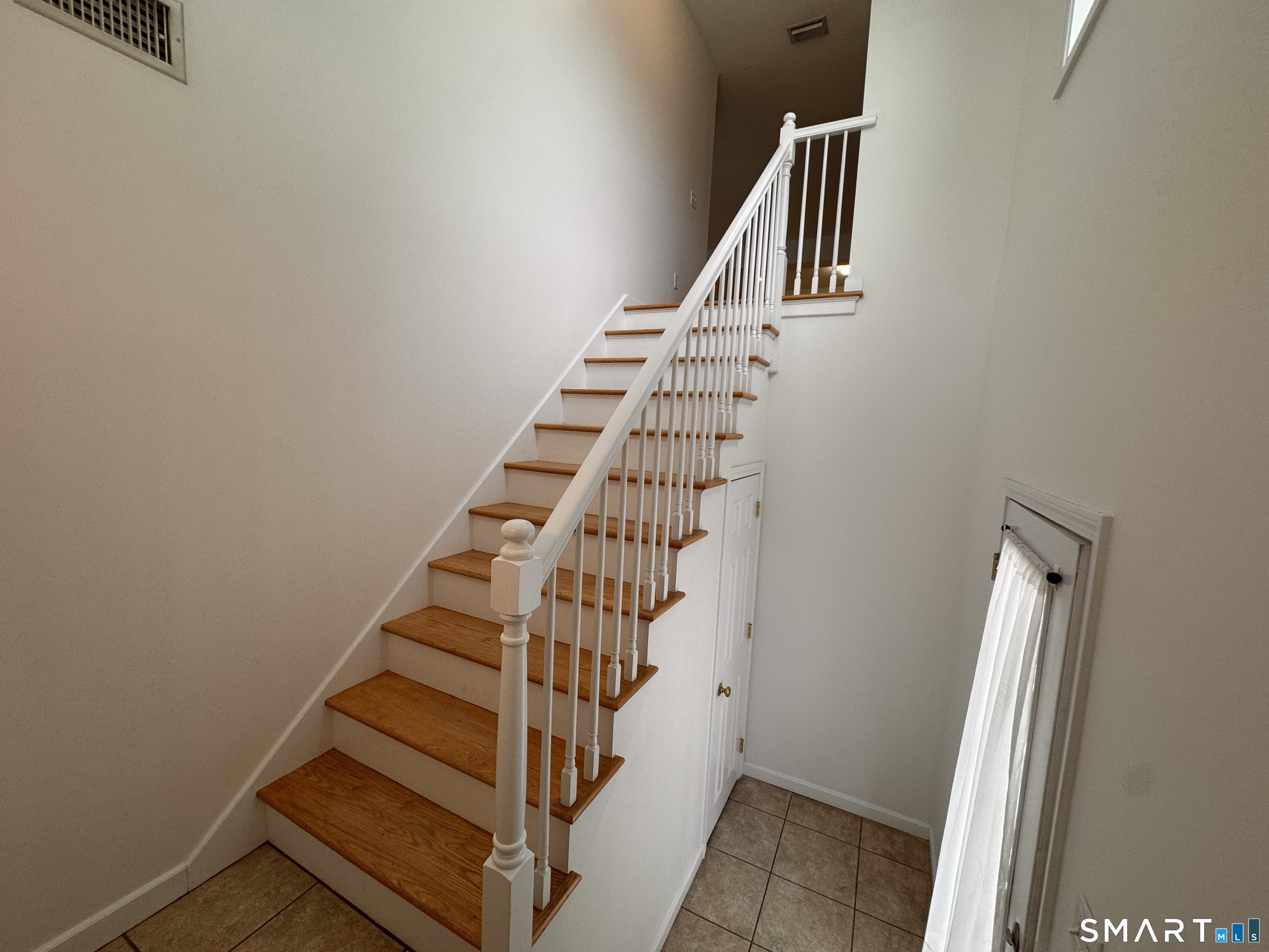 128 Meridian Street, Unit 211 Groton, CT 06340 - Photo 14 of 23 a view of entryway with stairs and wooden floor