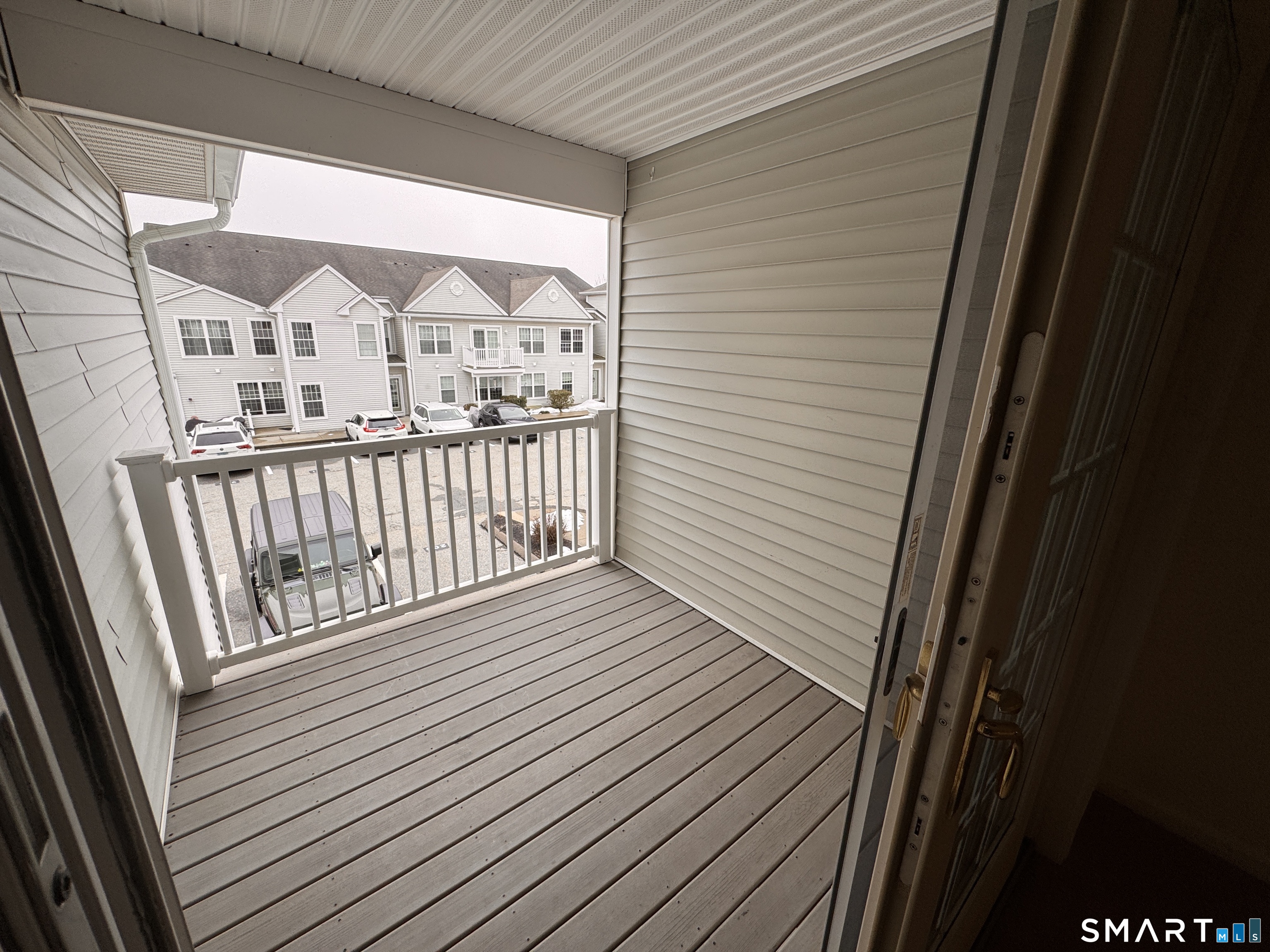 128 Meridian Street, Unit 211 Groton, CT 06340 - Photo 2 of 23 a view of a balcony with wooden floor