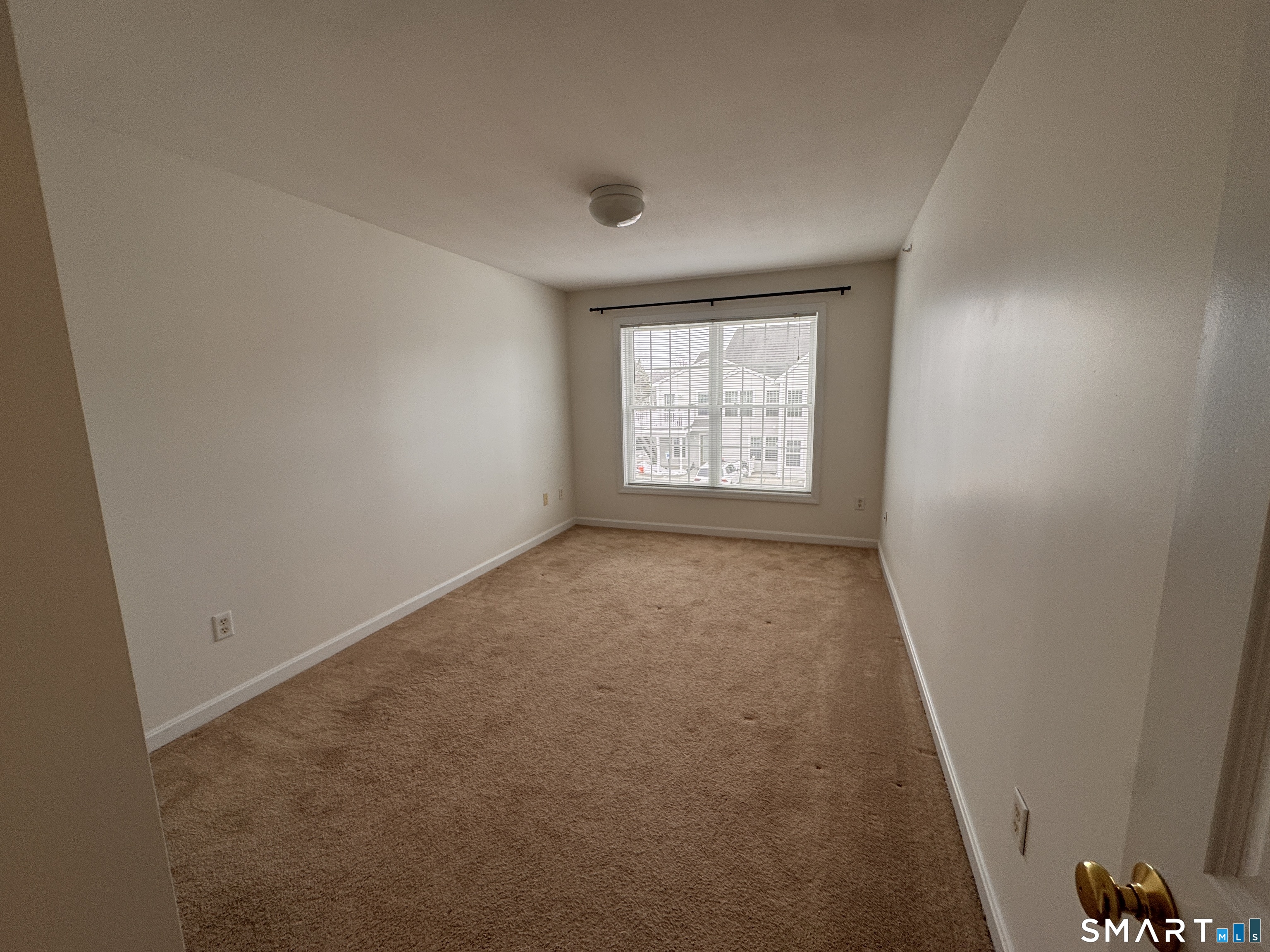 128 Meridian Street, Unit 211 Groton, CT 06340 - Photo 5 of 23 an empty room with windows