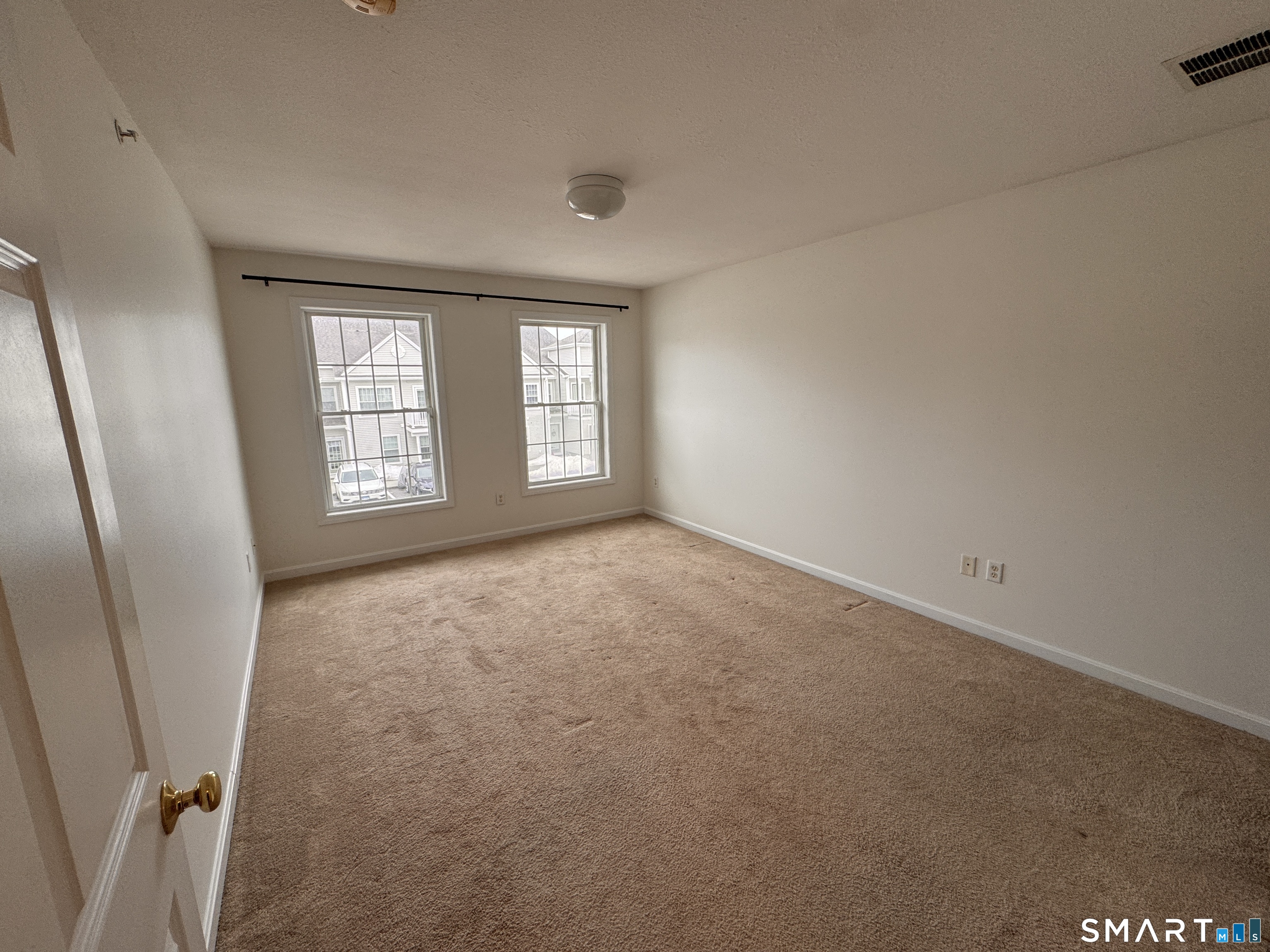 128 Meridian Street, Unit 211 Groton, CT 06340 - Photo 7 of 23 an empty room with windows