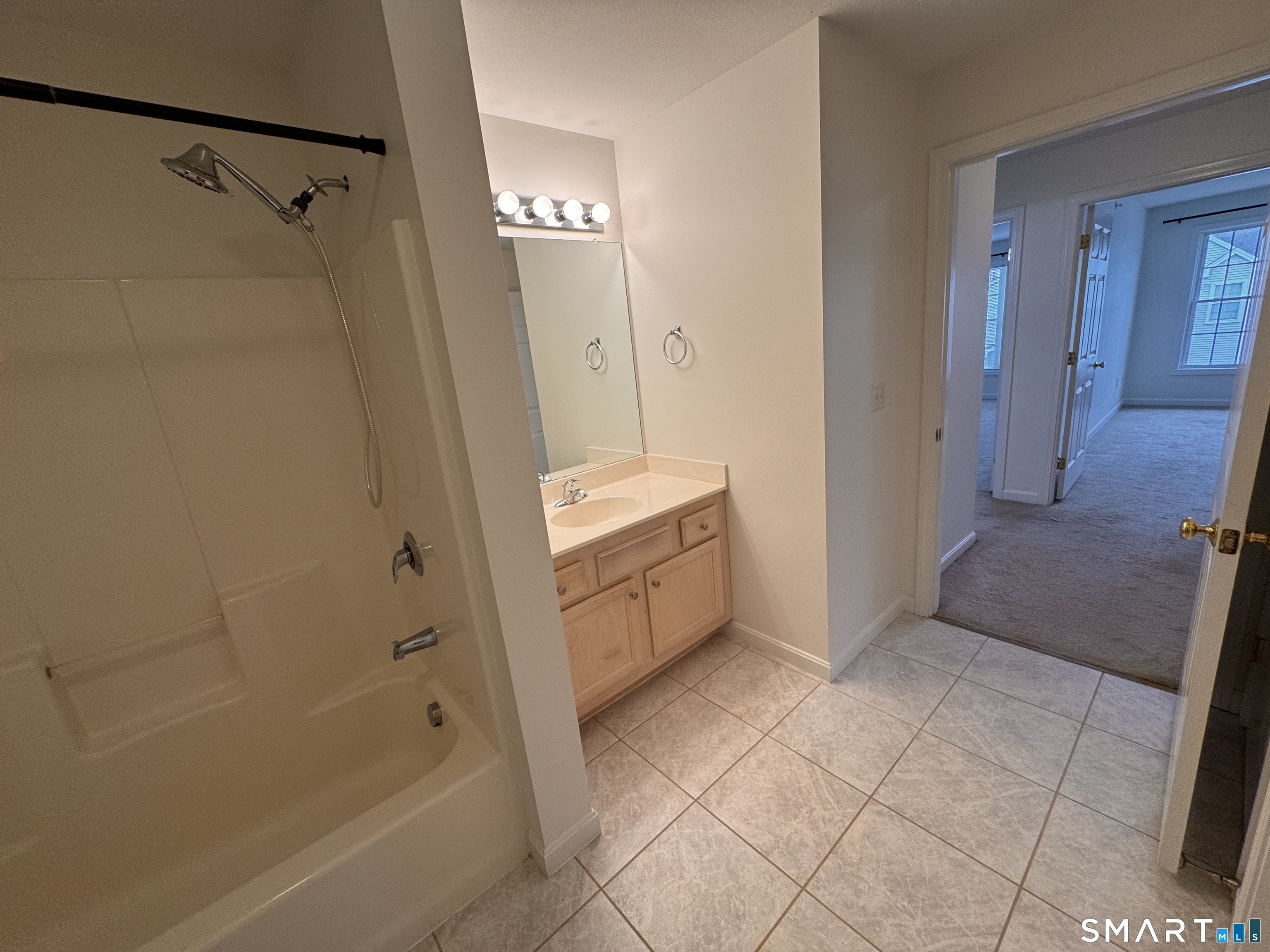 128 Meridian Street, Unit 211 Groton, CT 06340 - Photo 9 of 23 a bathroom with a bathtub and a shower