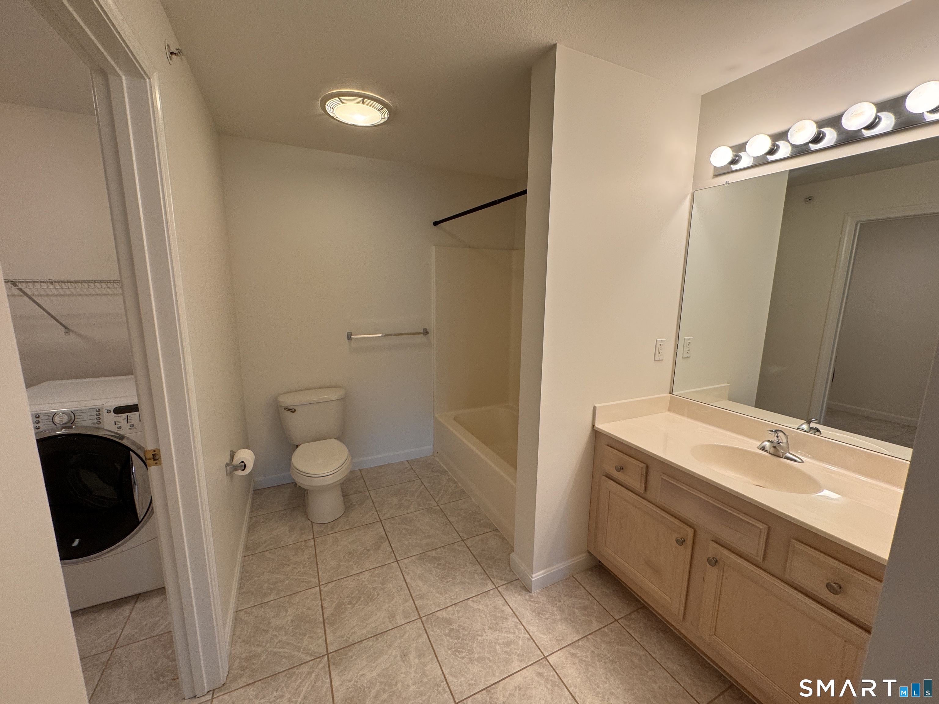 128 Meridian Street, Unit 211 Groton, CT 06340 - Photo 10 of 23 a spacious bathroom with a granite countertop sink toilet and shower