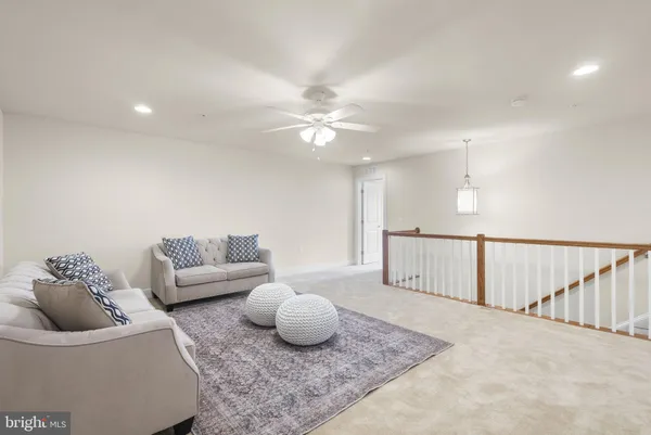 a living room with furniture and a rug