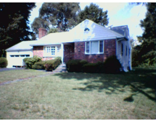 4 Ginn Road Winchester, MA 01890 - Photo 1 of 1 a front view of a house with a yard and garage