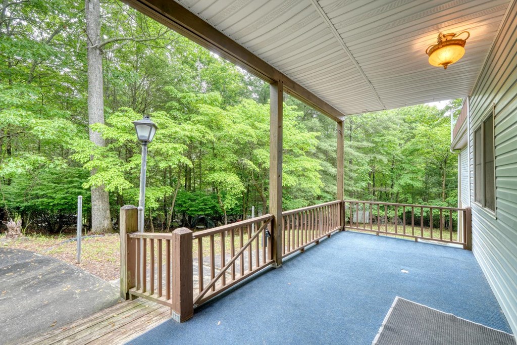 1066 Ridge Road Hiawassee, GA 30546 - Photo 32 of 51 a view of a porch with wooden floor and outdoor space
