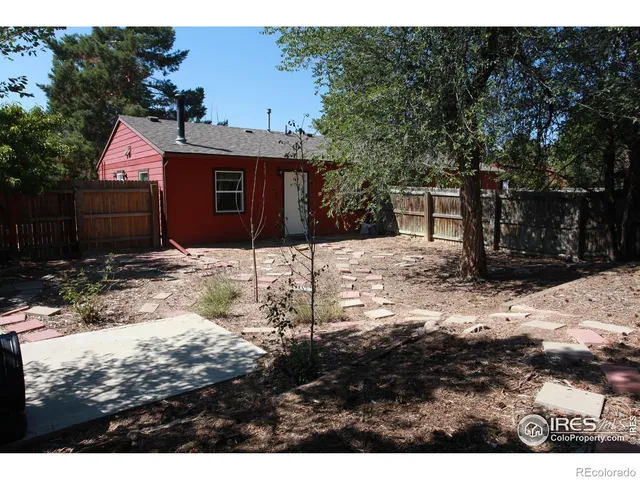a view of a backyard of a house
