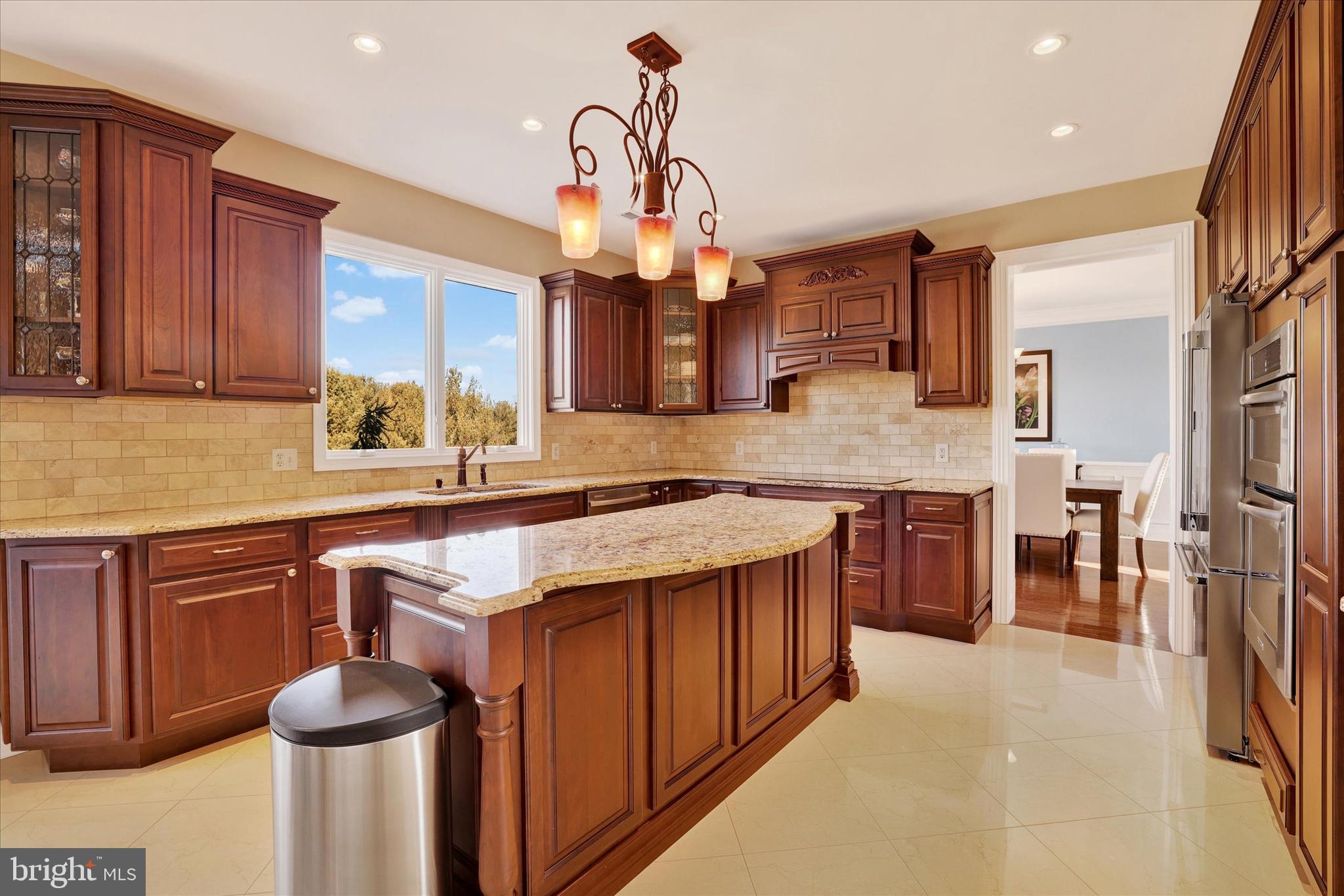 131 Hope Road Holland, PA 18966 - Photo 13 of 55 a kitchen with stainless steel appliances granite countertop a sink stove and refrigerator