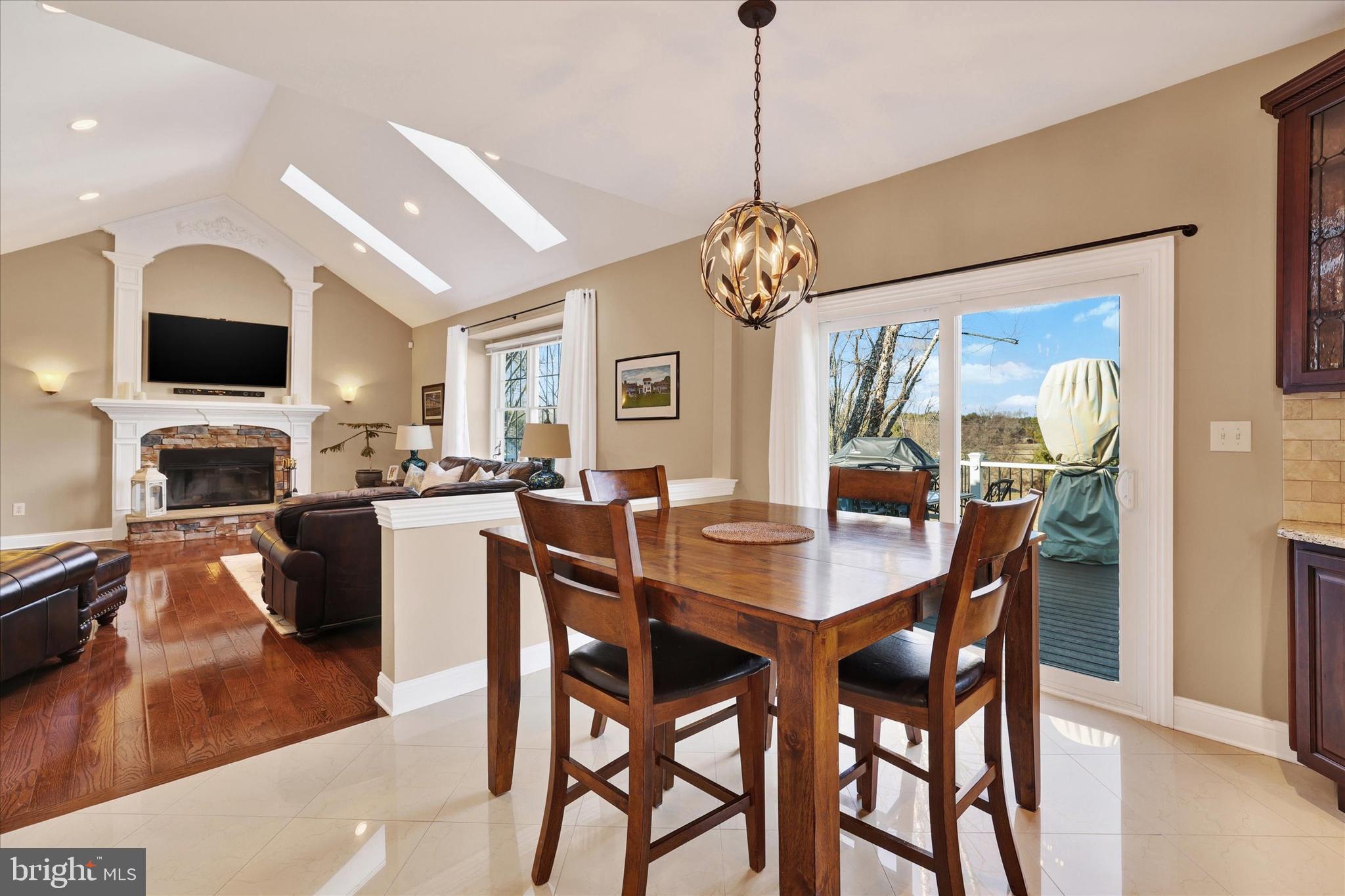 131 Hope Road Holland, PA 18966 - Photo 16 of 55 a view of a dining room with furniture a chandelier and wooden floor