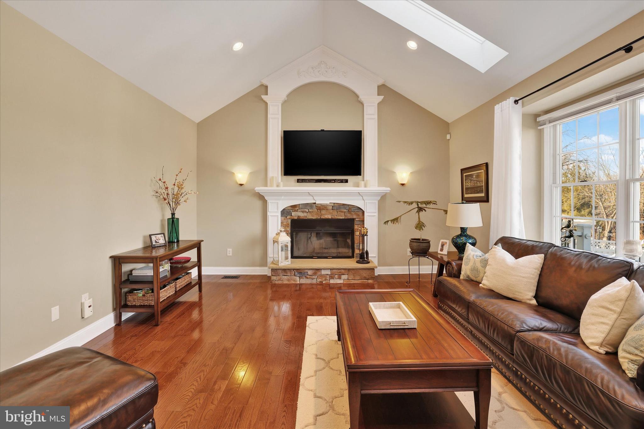 131 Hope Road Holland, PA 18966 - Photo 18 of 55 a living room with furniture a flat screen tv and a fireplace
