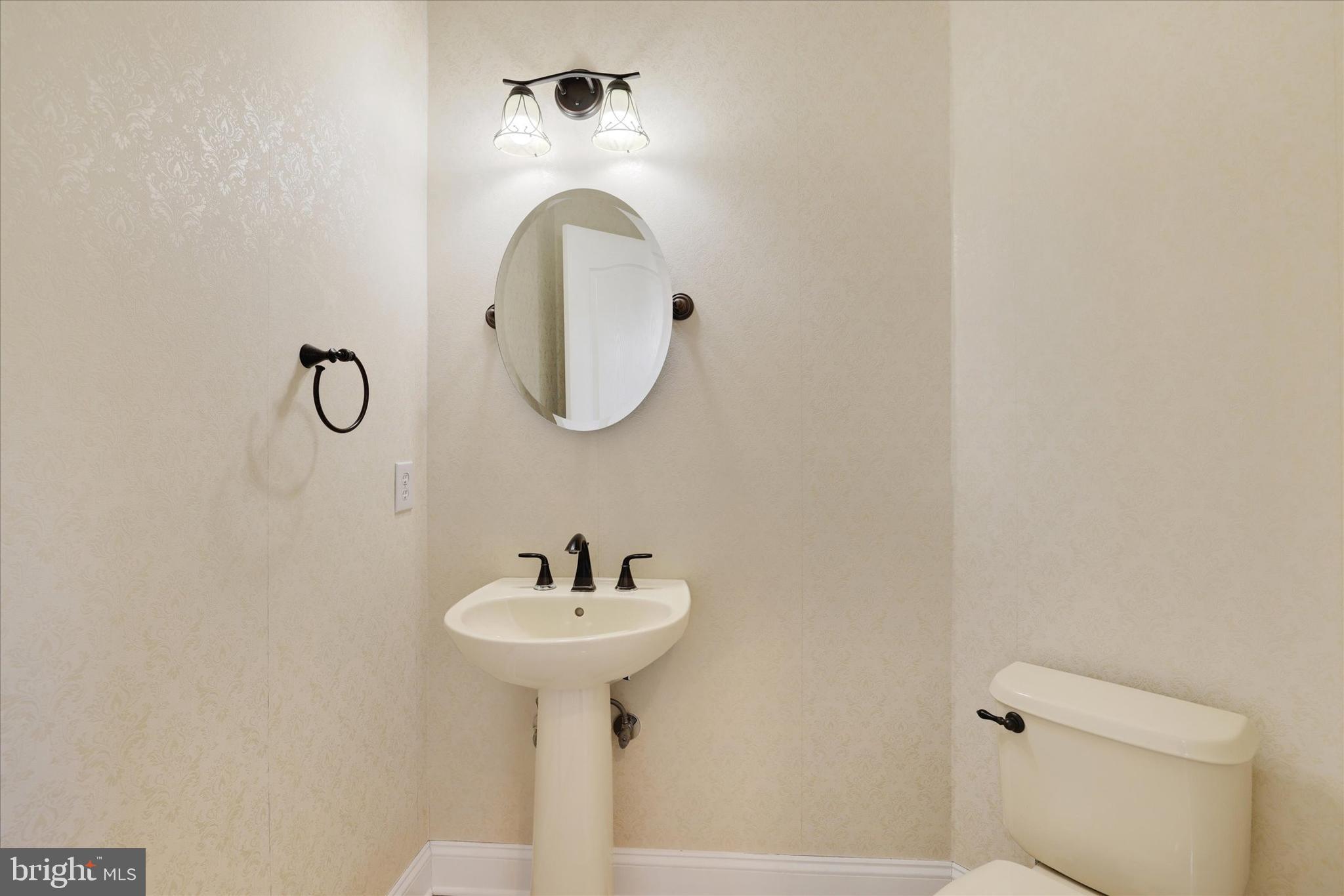 131 Hope Road Holland, PA 18966 - Photo 23 of 55 a bathroom with a sink toilet and a mirror