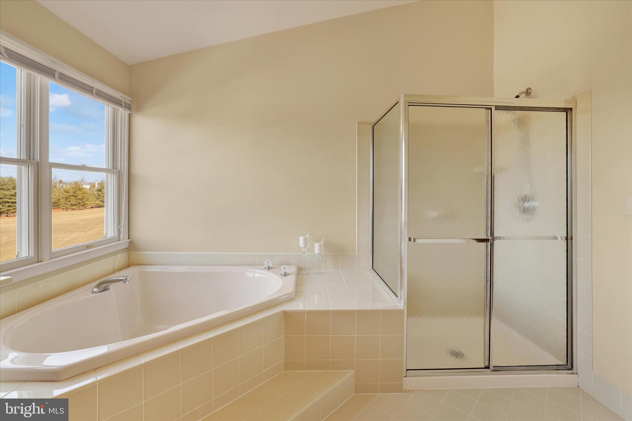 131 Hope Road Holland, PA 18966 - Photo 28 of 55 a bathroom with a bathtub and a shower