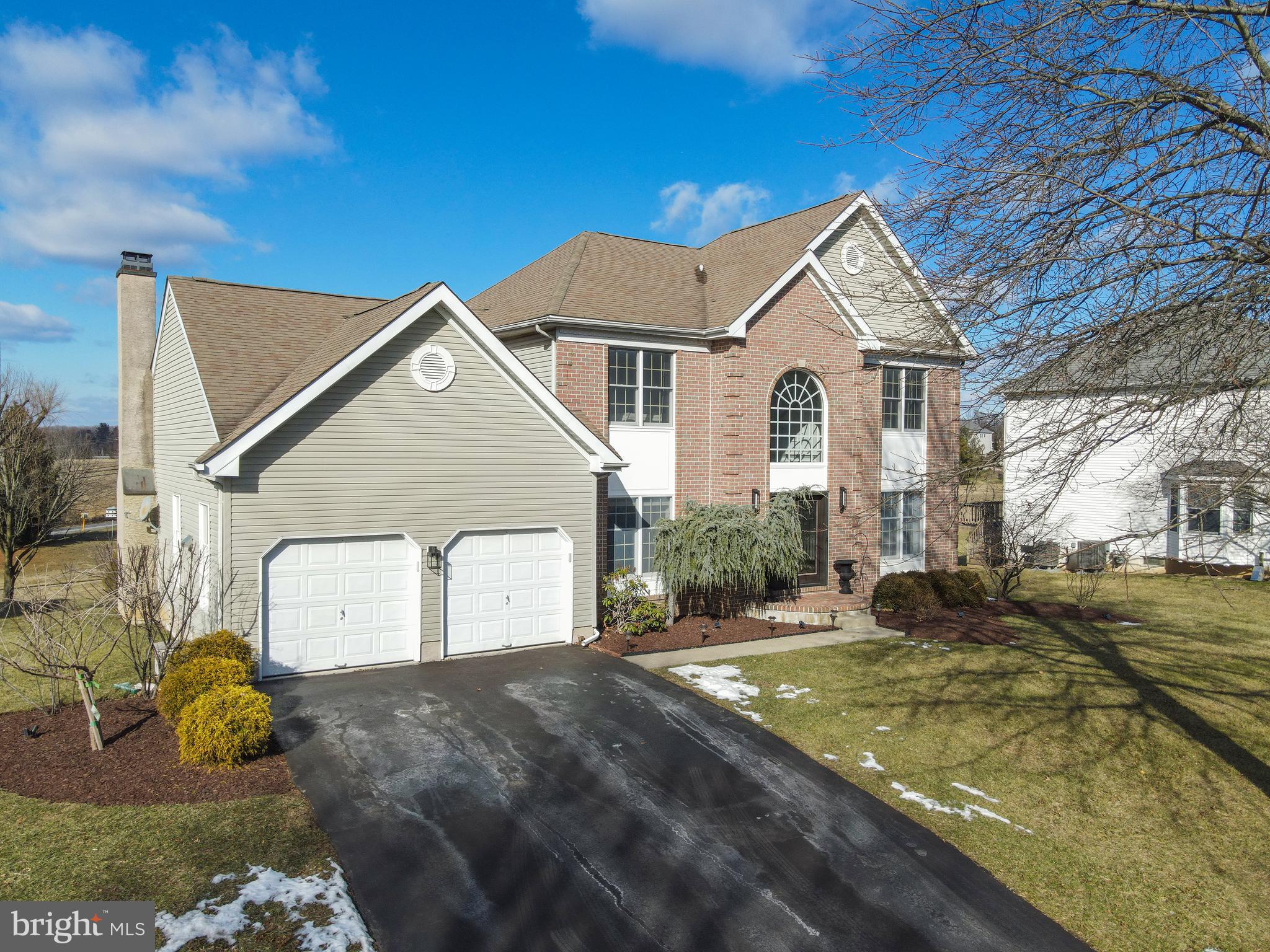 131 Hope Road Holland, PA 18966 - Photo 51 of 55 a view of a white house next to a yard with big trees