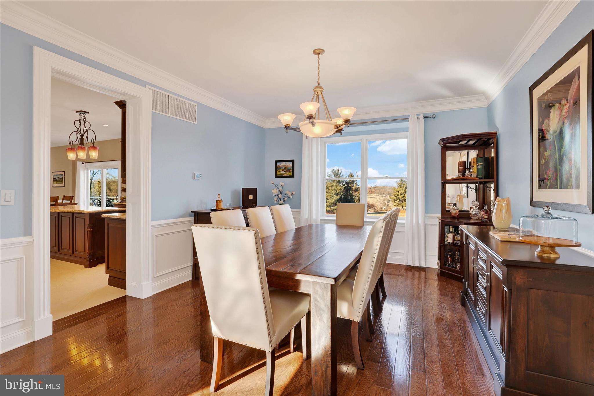 131 Hope Road Holland, PA 18966 - Photo 10 of 55 a dining room with furniture a chandelier and wooden floor