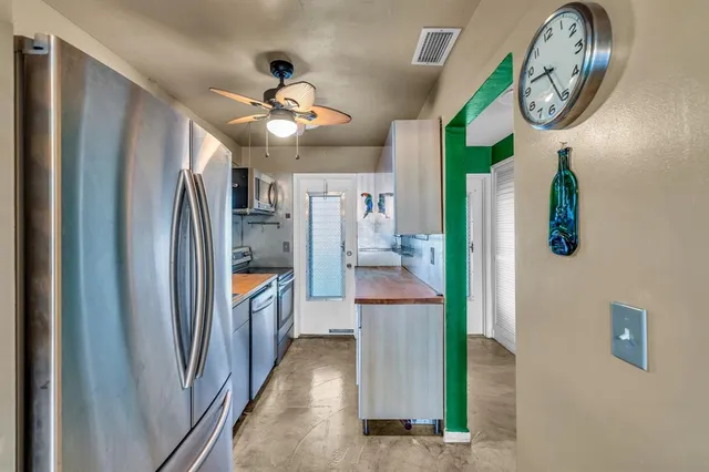 a view of a hallway with windows