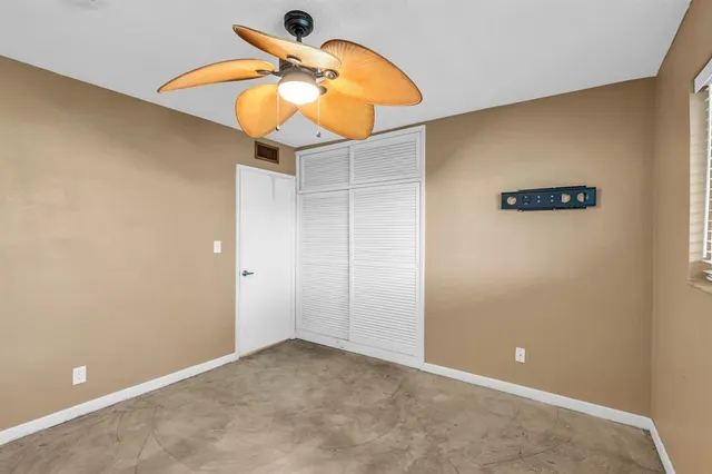 a view of yard with swimming pool and green space