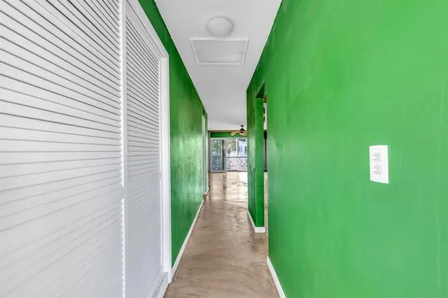 a view of a pathway of a house with plants