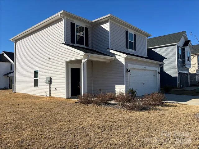 a kitchen with stainless steel appliances a refrigerator sink and cabinets