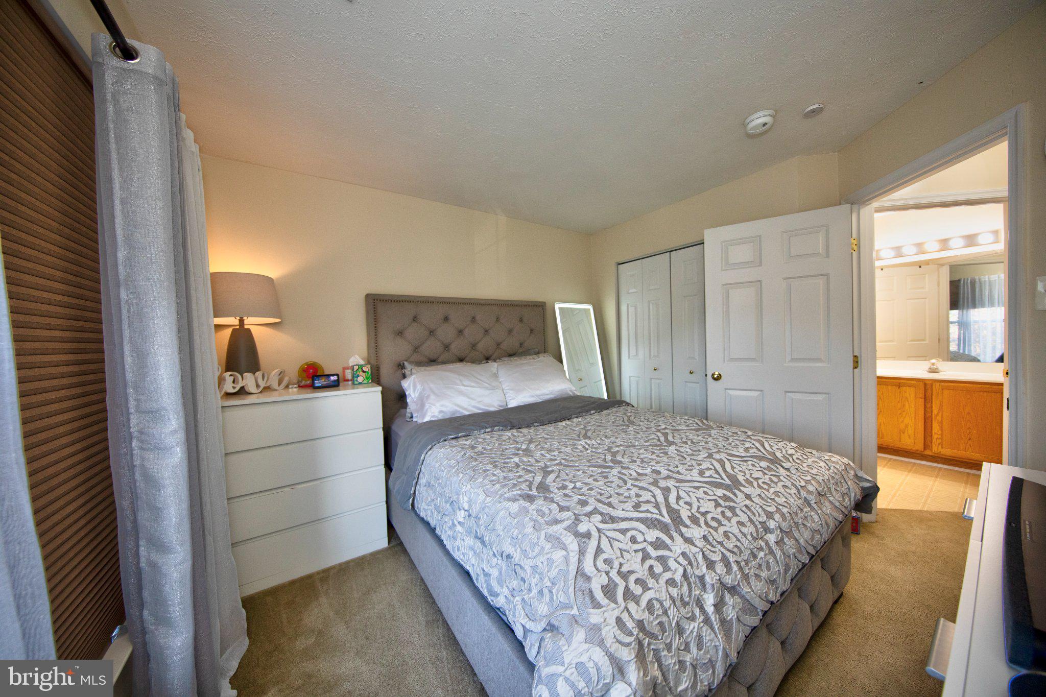 23 Caterham Court Rosedale, MD 21237 - Photo 18 of 27 Cozy bedroom with inviting ambiance.