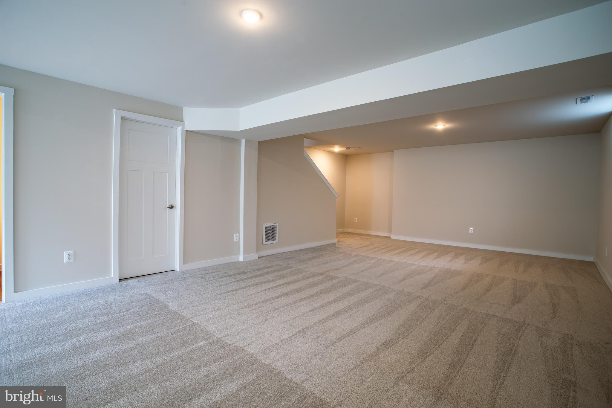 503 Boise Road Inwood, WV 25428 - Photo 55 of 83 a view of an empty room with wooden floor