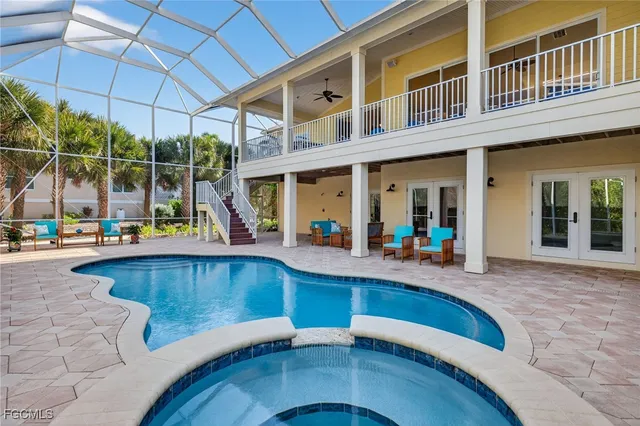 a view of a patio with swimming pool table and chairs