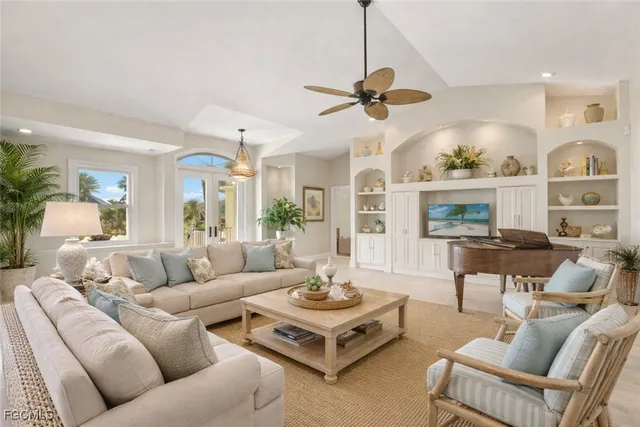a patio with a table and chairs under an umbrella