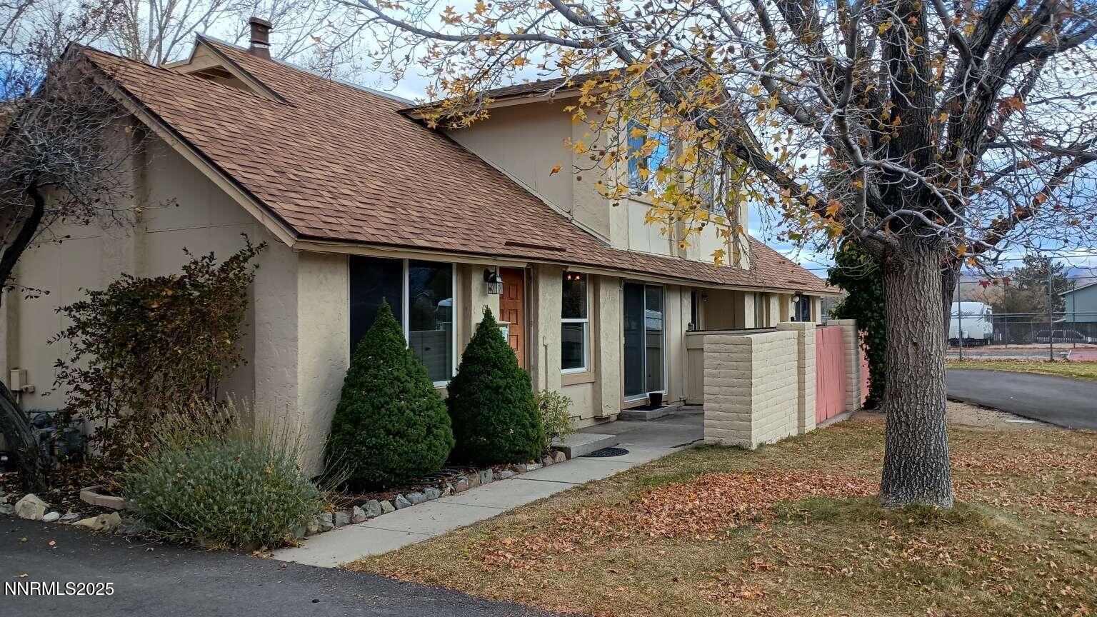 68 Condor Circle Carson City, NV 89701 - Photo 2 of 23 a front view of a house with garden